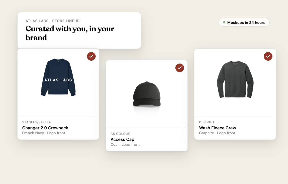 A curated swag store lineup: crewneck with the company logo, cap, and fleece, each marked selected